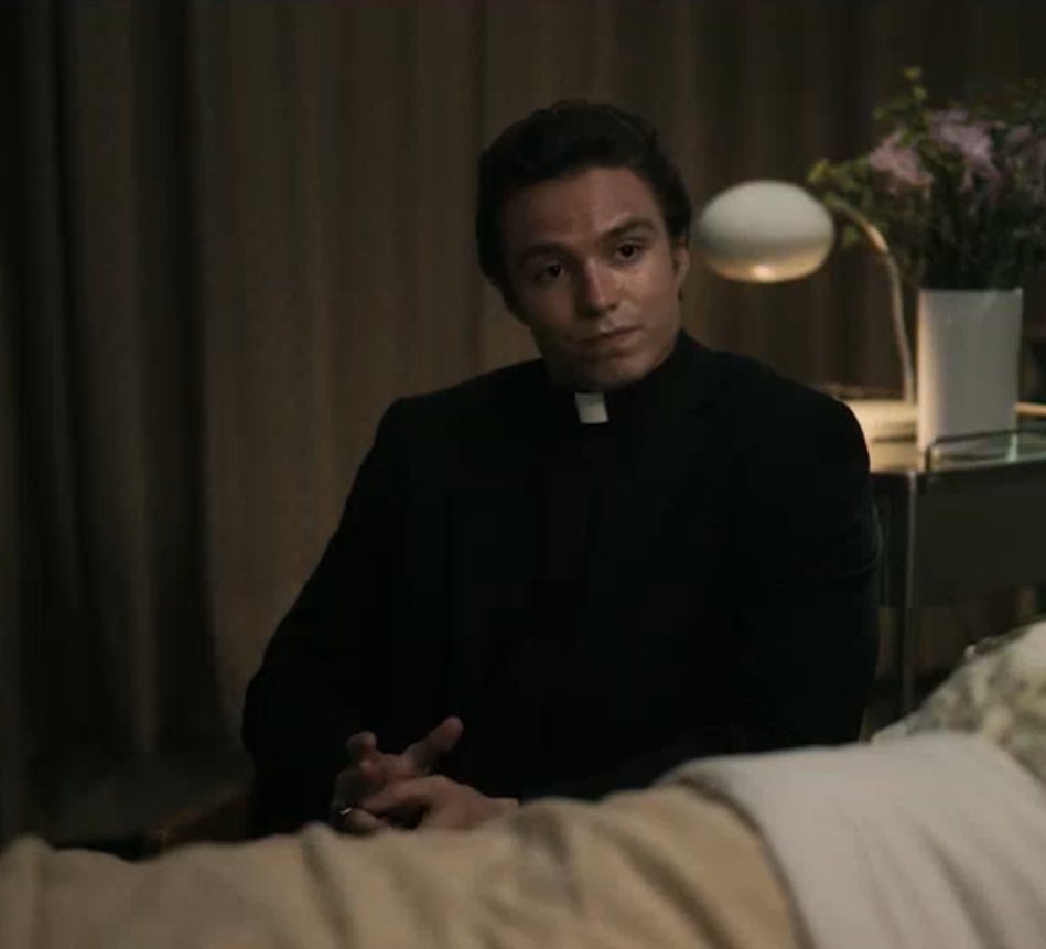 Nicholas Alexander Chavez as Father Charlie Mayhew in #Grotesquerie 1x05