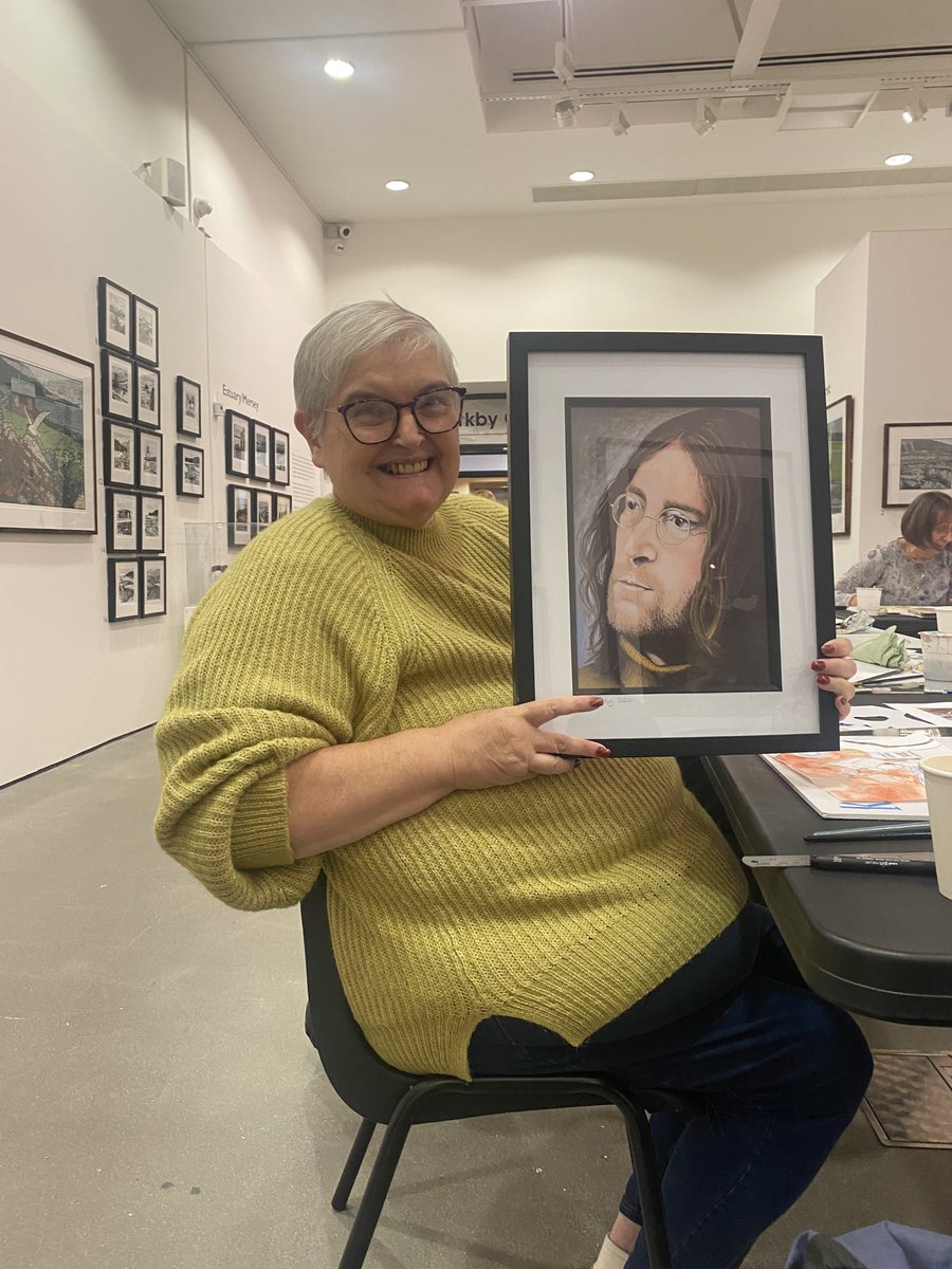 During the Sumner Art Sessions this week in Kirkby Gallery, as funded by Art Friends Merseyside, artist Gill Cowley raffled one of her framed prints of her study of John Lennon, to raise funds for ‘Friends of Kirkby Gallery &amp; Prescot Museum’. Well done to the lucky winner Karen!