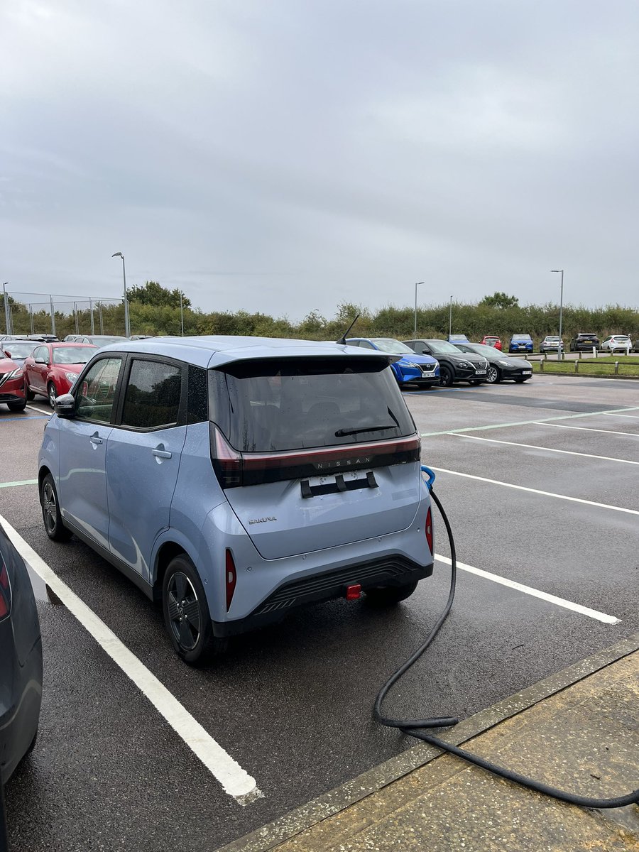 Casually resting on charge at a Nissan media event in Cranfield. Sakura kei car EV: 3.4m long, seats four, hits 80mph, has a claimed 112 mile range from a 20kWh battery and costs from the equivalent £12,700 in Japan. Do we want it? (Yes)