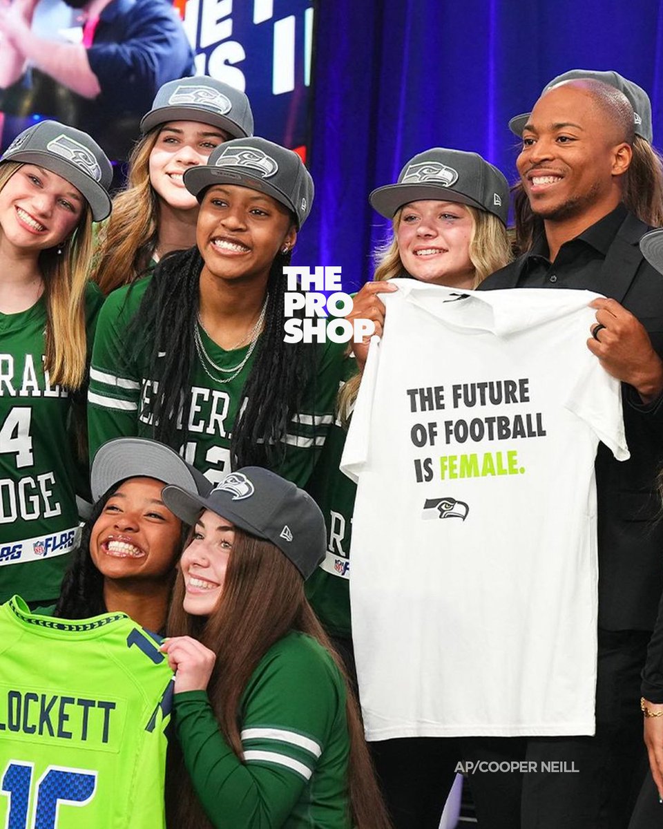 The Future Of Football Is Female Collection, has DROPPED!

During the 2024 NFL Draft in May, Tyler Lockett helped put a spotlight on Girls Flag Football by announcing the Seahawks third-round pick and holding up a powerful t-shirt while standing alongside a local girls flag high