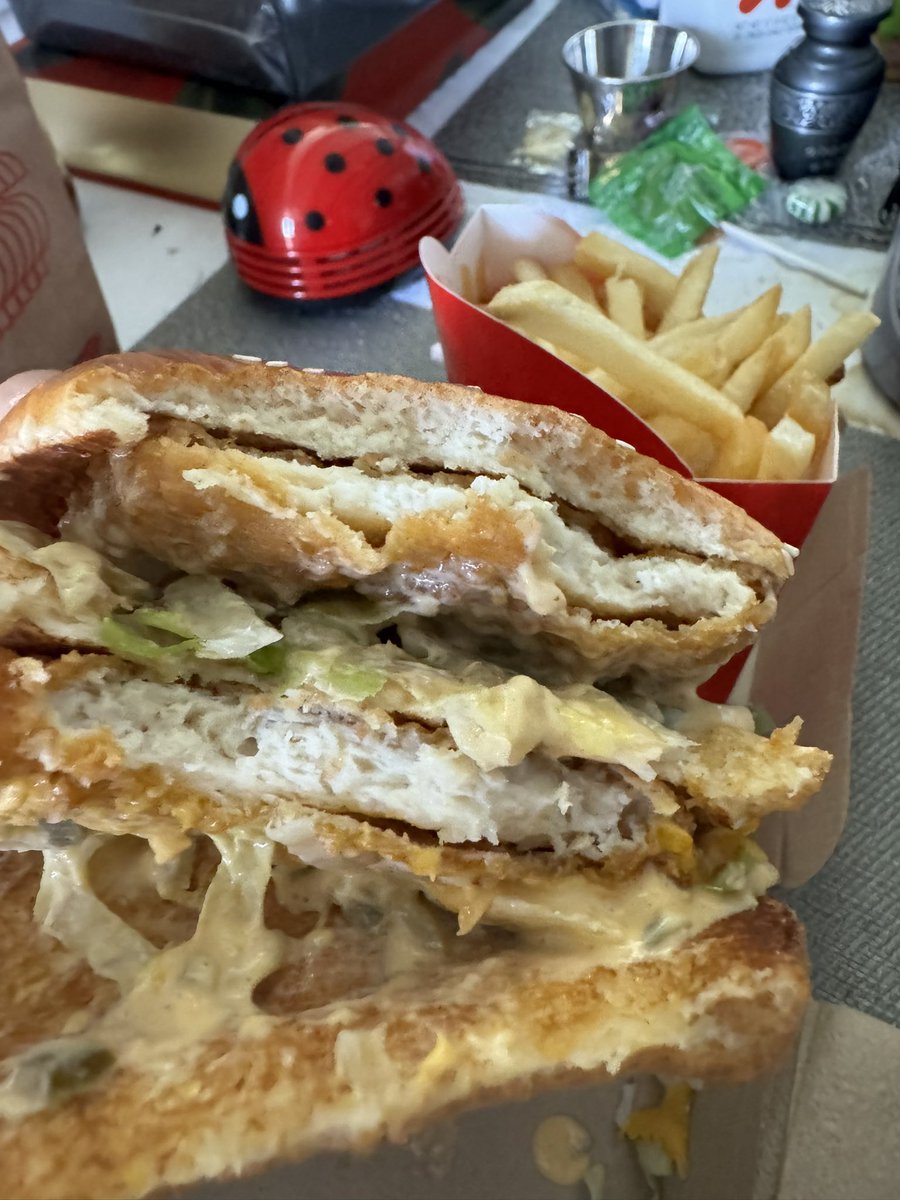 Rendiggy's tweet photo. @McDonalds #ChickenBigMac review. The patty is tempura battered, so it’s a huge McNugget. Any of your fave McNugget sauces would be 🔥 instead of the Big Mac sauce. I’d try hot mustard+sweet &amp; sour next. No BM sauce, that answers the❓“Is this a Big Mac?” Verdict? Good, but 🤷🏽‍♂️ https://t.co/QCkq9zq0eX