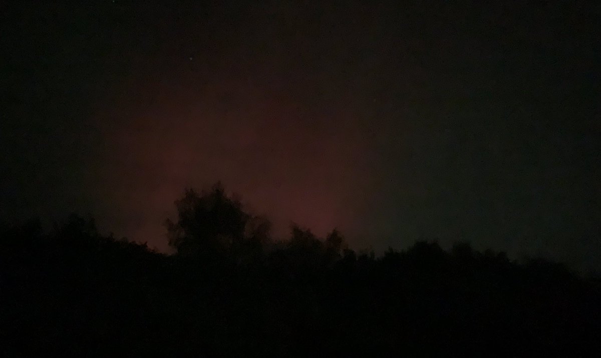Nice aurora borealus the night even in light pollution of town
