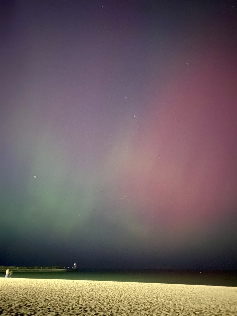 aurora borealis in chicago tonight (no editing) - even with fighting the light pollution it was visible to the naked eye. this was unbelievable, crossed something off of my bucket list without even having to leave the city