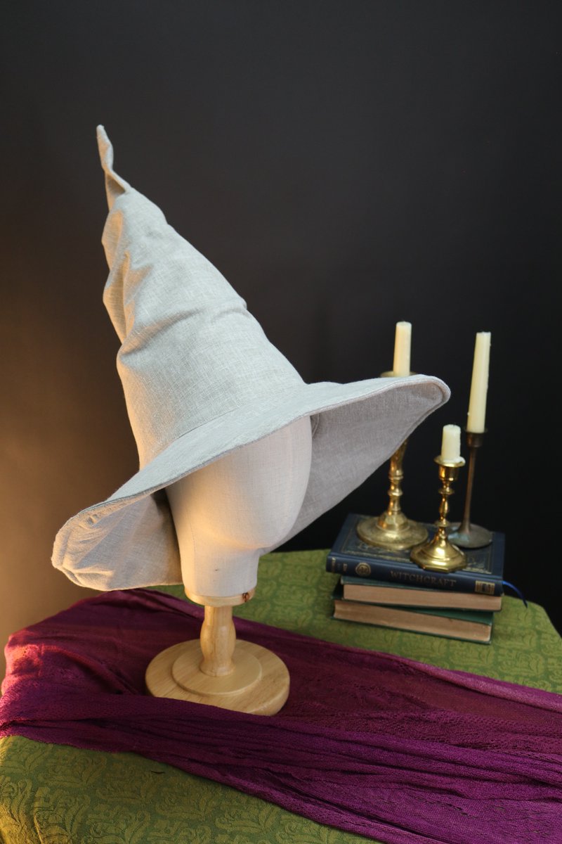 Steffeystitch's tweet photo. Crafting new wizard hats with rich textures—faux suede, linen, and some stunning vintage wool. Perfect for Halloween and festival season! Come check them out in person this sunday at Sea Hive Station #WizardHats #Handmade #HalloweenStyle #steffeystitch https://t.co/RGACdj8zwJ