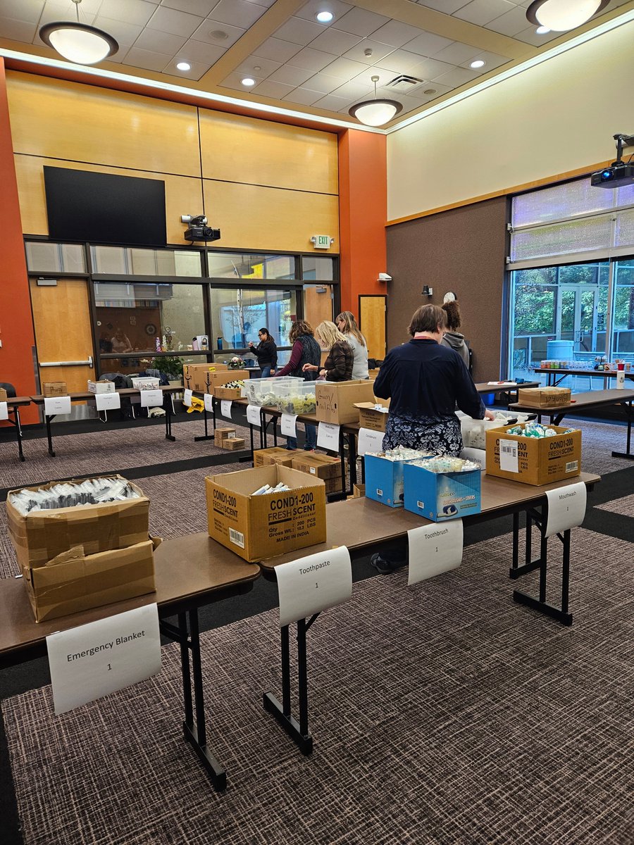 KCLSFoundation's tweet photo. Last week, a group of volunteers gathered to assemble 500 Hygiene Kits! These hygiene kits will be distributed at libraries, shelters, day centers and tent encampments to people experiencing housing insecurity throughout King County. https://t.co/IggZpLsf47