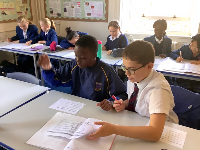 StNicksLang's tweet photo. #StNicksYear6 French pupils revising for next week’s quiz with a round of ‘One pen, One Dice’, taking turns translating key sentences in a race for success. Great work today, Year 6! #StNicksFrench #StNicksLanguages #mfltwitterati https://t.co/9Dhsu8EtSw