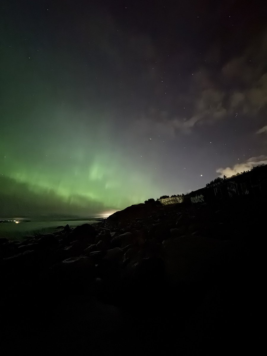 PaulDurdle's tweet photo. Last night, I crossed another item off the astro-bucket list. To see the aurora so vividly, dancing quickly across the sky above the ocean and Bell Island, was truly awe-inspiring. Well worth the late night trip to the beach away from everyone. 🌌

#nlwx #nlastro https://t.co/mjsvAaa64X