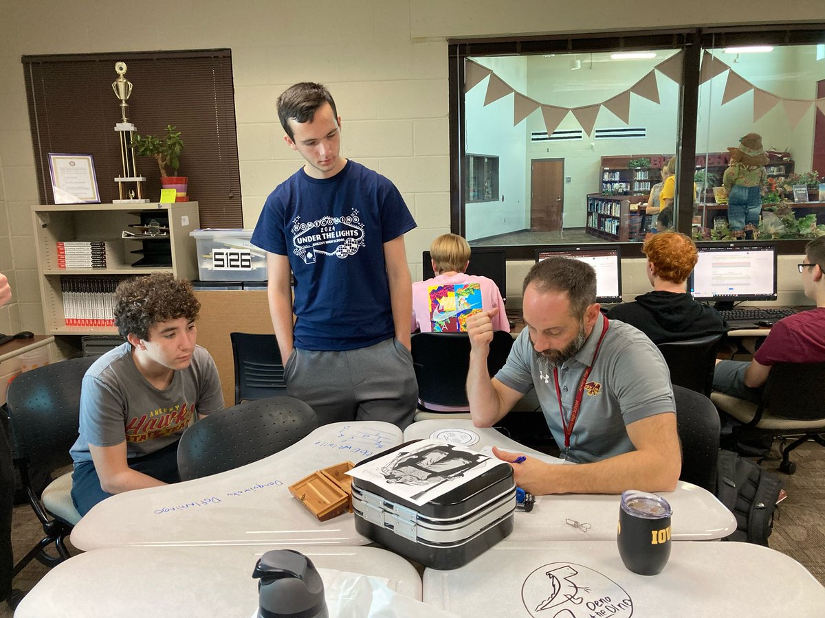 Ankeny_HS's tweet photo. Engagement might be the theme of the day as Mr. Monahan &amp; Mr. Grinhaug work with some of our Computer Science Hawks in Ms. Poole’s CS class to problem solve an Escape Room activity. https://t.co/yN0LvuOQ4g