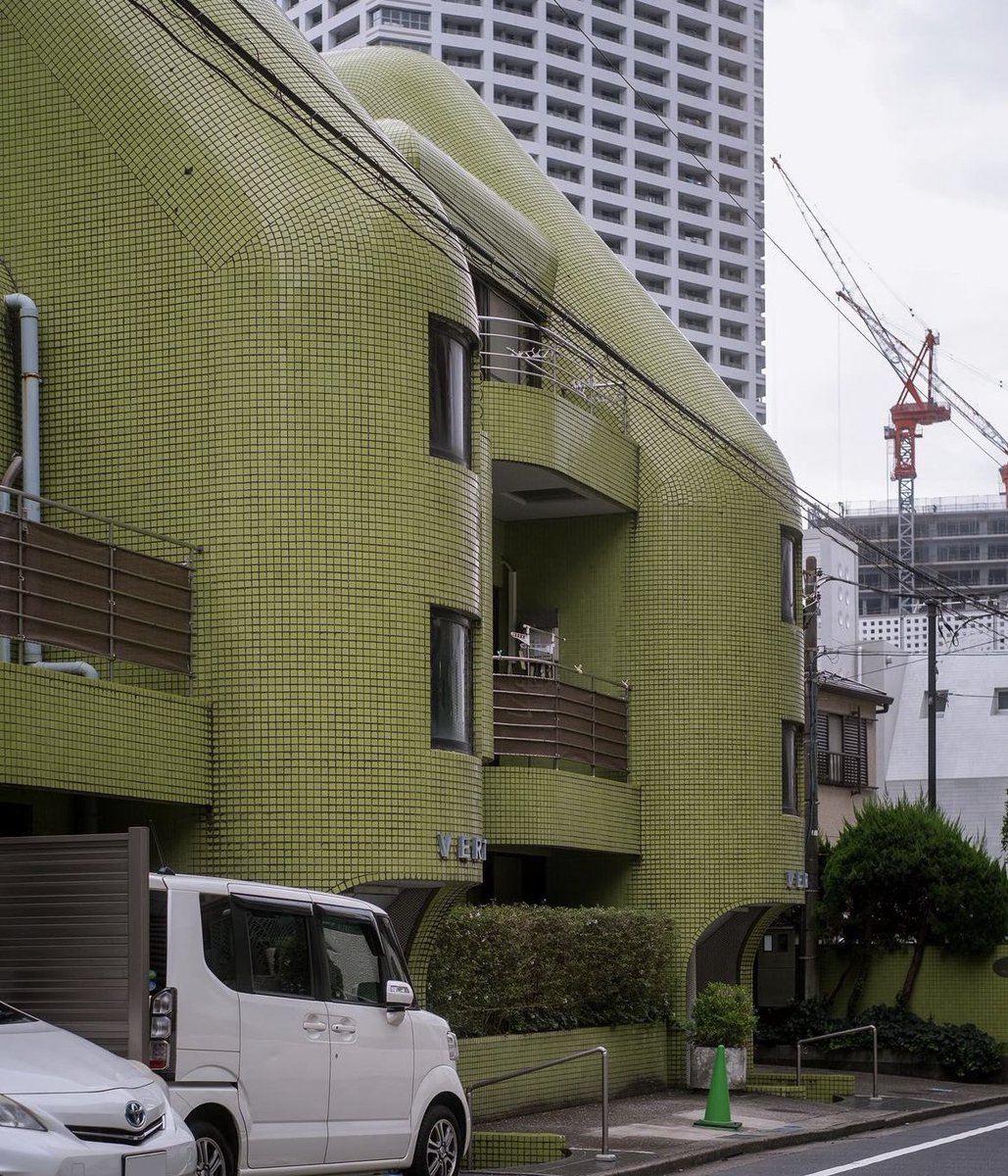 A beautiful green tile facade at this apartment building in Nakano, Japan
