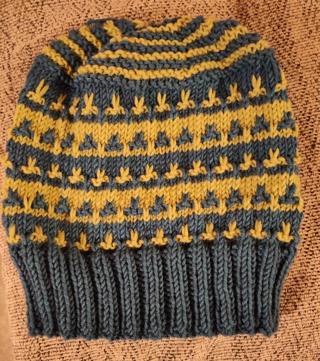 Latest Christmas hat. For my lovely little boy. A miniature version of his Dad's. I've converted to circular needles now, so no awkward seam. However for the top I had to go onto double pointed needles which I HATE!