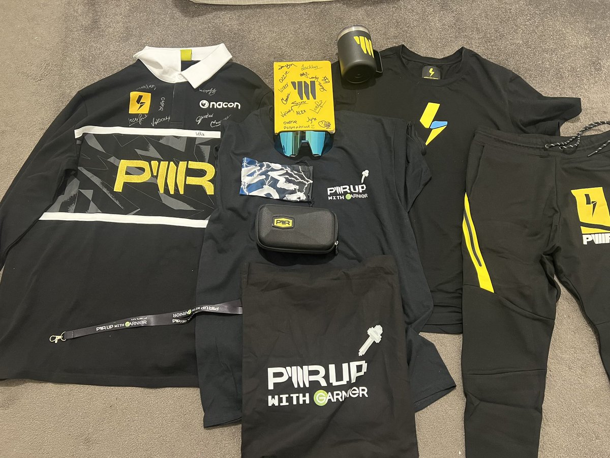 This is a photo of all the <a href="/TeamPWR/">PWR</a> gear I collected this year at PAX…. Except for the notebook, I got that at the Pop-up last year but I’ve almost got every member to sign it, I am just missing <a href="/CoachTimmy/">PWR Timmy</a>