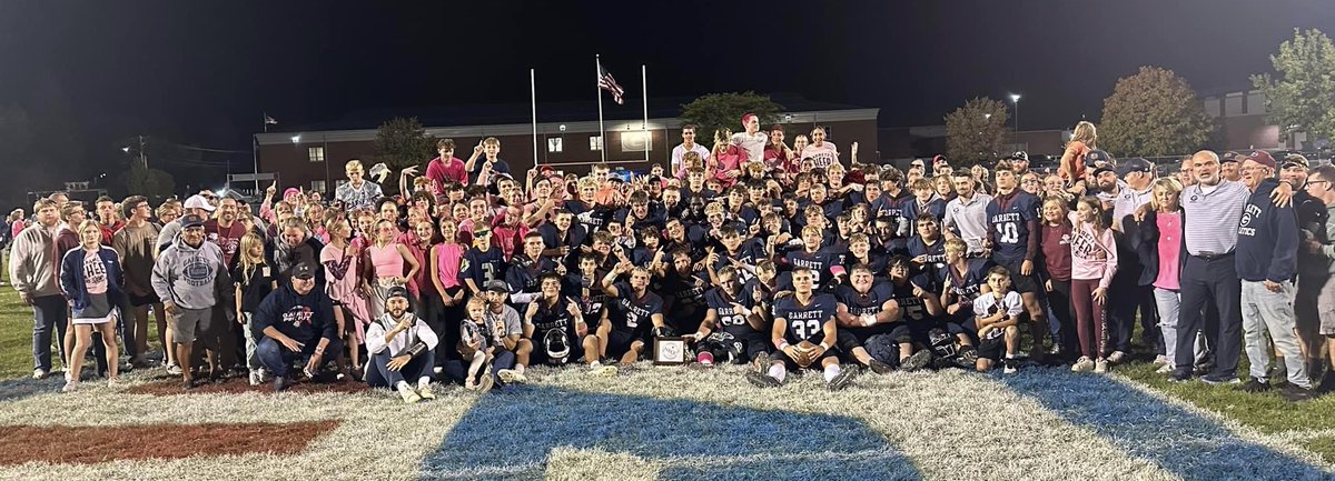 I love this pic. Yes, the trophy up front, 2024 NECC Champions. But more importantly, it’s all the rest: the awesome GHS students, proud parents (even my dad), families &amp; community, USA flag &amp; our school in the background, &amp; the always illuminated “G” on our brick wall!  Perfect!