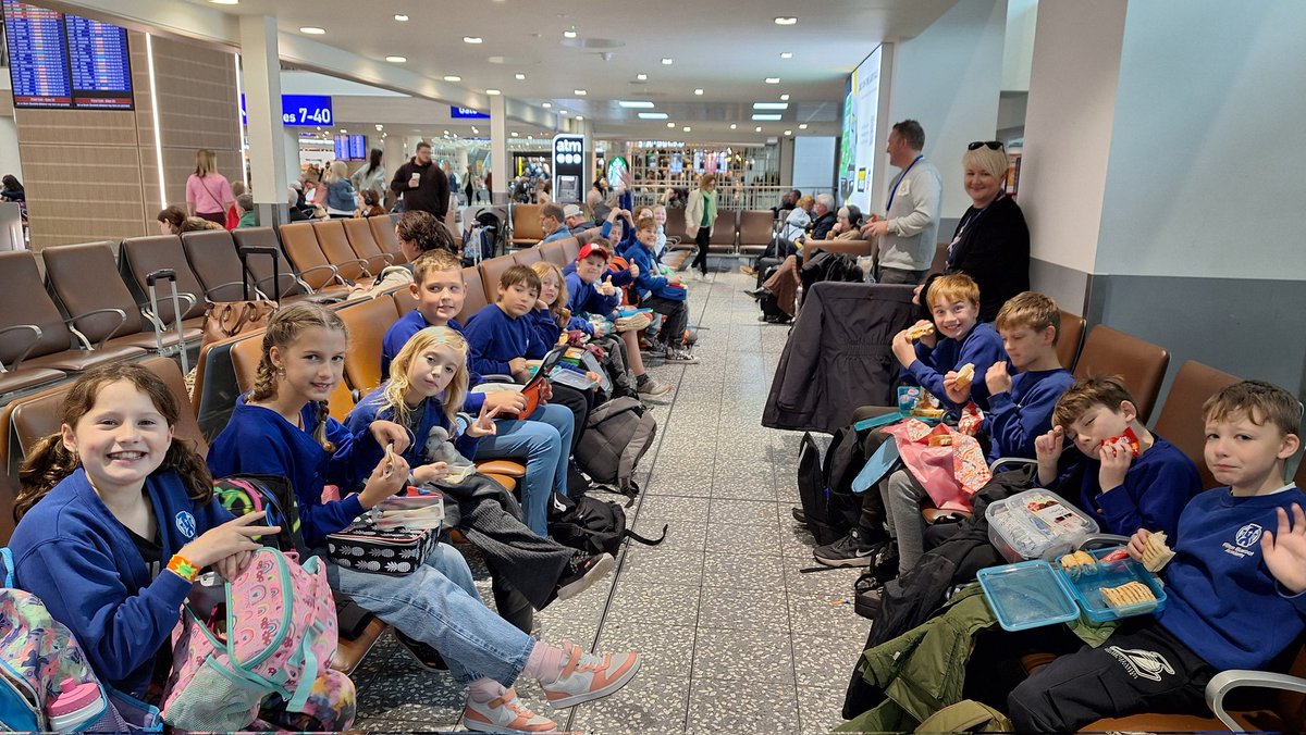We've arrived at Bristol Airport ready for our flight to Berlin. Everyone is busy eating an early lunch.