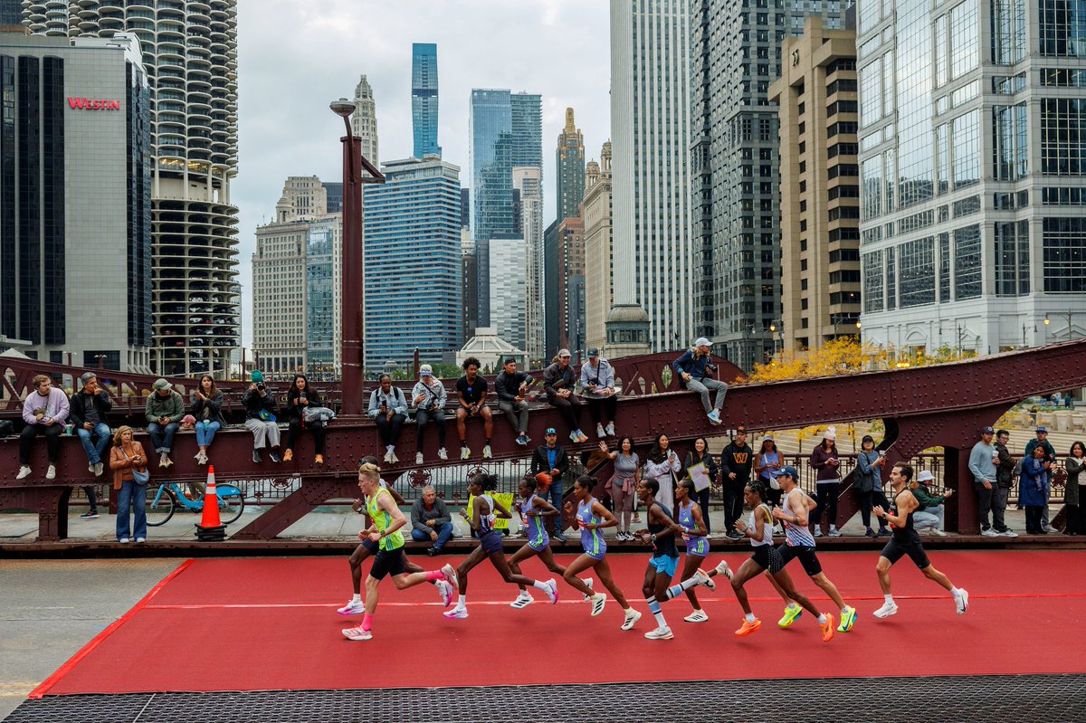 Runners cross the LaSalle Street bridge during the Chicago Marathon Sunday morning in Chicago.