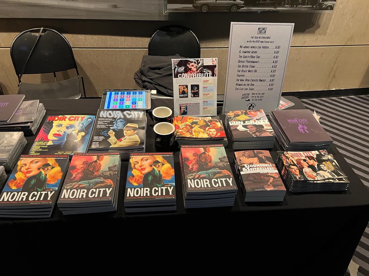 MWKronenberg's tweet photo. If you’re at NOIR CITY DC, go see some great movies and buy some @noirfoundation merchandise. FYI: I designed every item on that table. #NoirCityDC https://t.co/1IcR4aqzfz