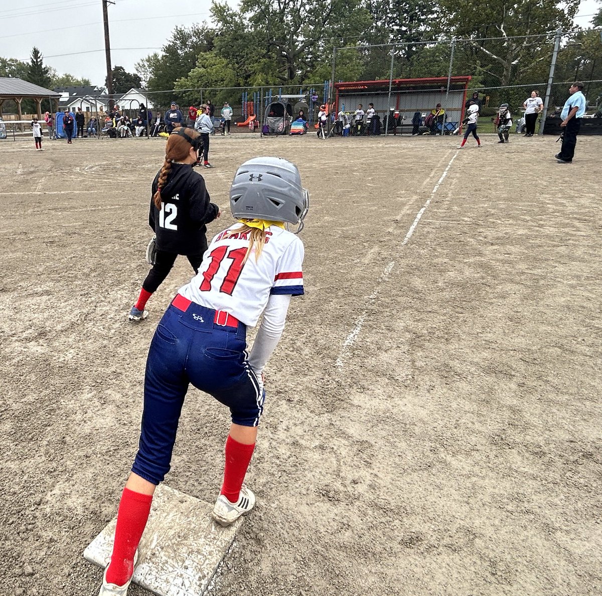 A rainy, miserable day on the diamond but the girls walked away with two more wins.