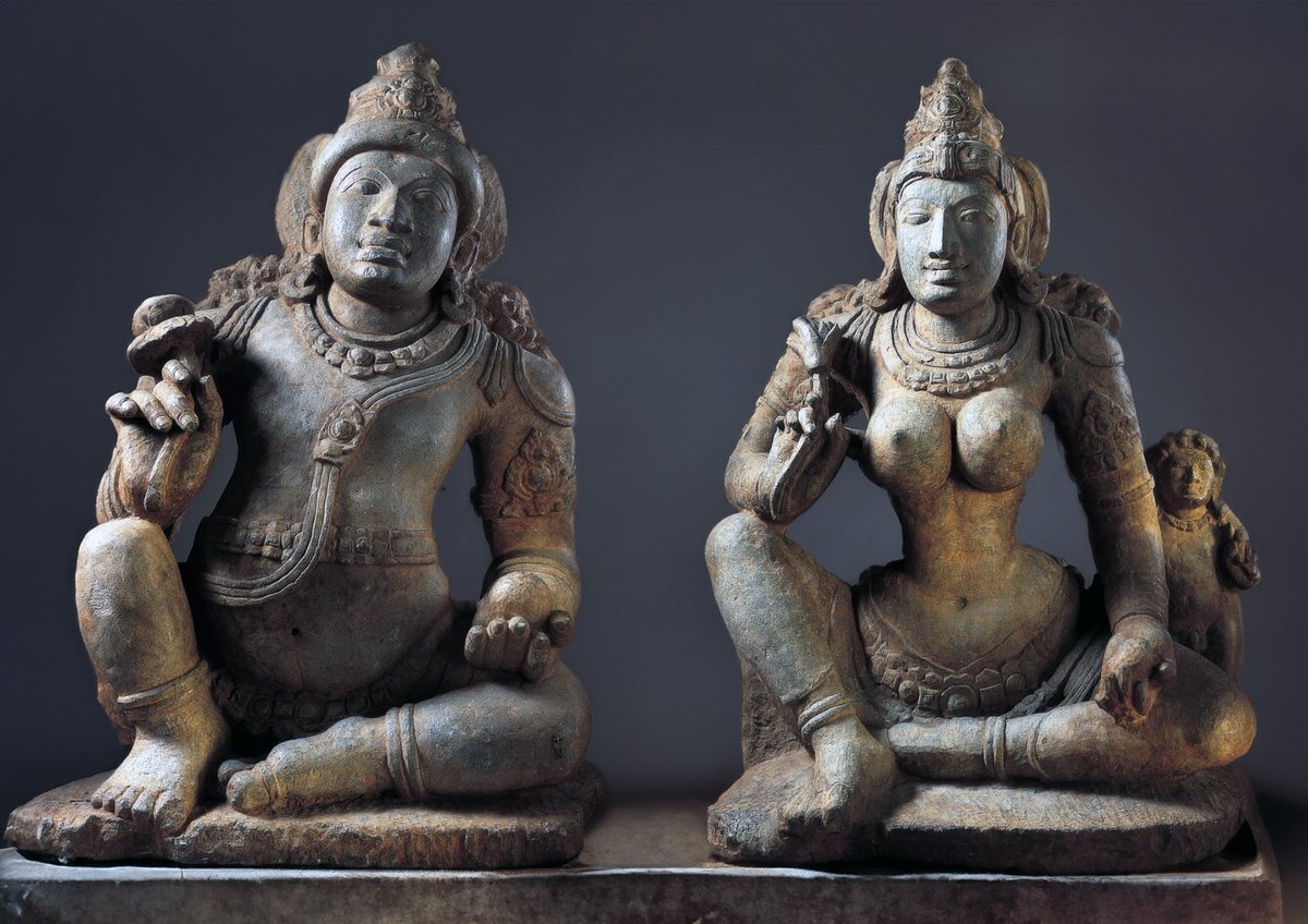 Kushmandini and
Sarvanubhuti Jain yaksh  yakshini of Neminath Teerthankar 
Often depicted with her children under a tree,  in the right hand bunch of small mango like fruits, and a lion on which she is seating. 

 #Jainism #Ambika #karnatakajains #kushmandini #yakahini
#yaksh