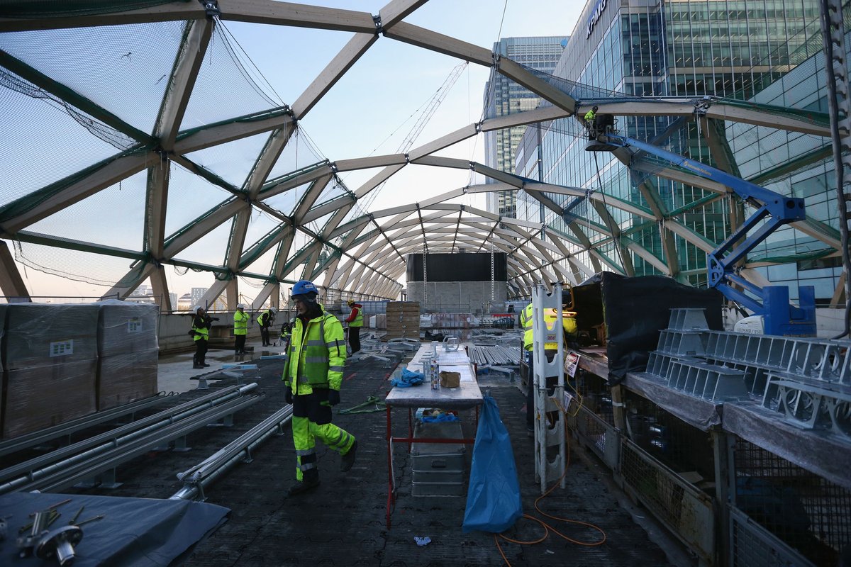 capbcon's tweet image. London built a major railway station inside a dock — and covered it with timber.

The Canary Wharf Elizabeth Line Station sits inside the former North Dock, constructed as a 300 m-long concrete box sunk into water, then capped with a ~4,500 m² laminated timber roof made from…