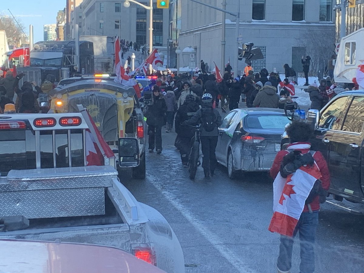 LichTamara's tweet photo. West meets East.

Four years ago, when @ChrisBarber1975, Jonathan, Zippy, and myself slowly made our way into Ottawa, we had no idea what would be awaiting us.   We were excited, anxious and hopeful.  

Unbeknownst to us until later in the day, we were just over 100km long and strong when we pulled into Arnprior the previous evening.  Behind us in convoy there were truckers, pilot vehicles, mechanic trucks, tow trucks, doctors, lawyers, nurses, servers, day care workers, business owners, ranchers, farmers, oil rig workers, teachers, government employees, former law enforcement personnel, veterans, citizen journalists, housewives, homeless and the hopeless given hope anew.   All walks of life, all demographics, all religions, all regions.  

Canadians from across the entire country came together in our nations capital asking for a polite conversation with their elected civil servants about their numerous and valid concerns.  They were ignored, maligned, laughed at, smeared, falsely accused of heinous behaviour and criminal activity, and, eventually, they became victims of the unlawful excessive use of force, the unconstitutional freezing of their bank accounts, and vexatious lawfare.  These good people have yet to receive as much as an apology for this unprecedented breach of their Charter Rights, let alone accountability.  

On this particular day, however, we arrived on a freezing cold day to a warm welcome and a sea of flags.  Everyone was riding the same tidal wave of hope on an ocean of darkness. 

Canadians stood proud and full of faith.  Canadian Truckers held the line to put a stop to nonsensical mandates. 

And they won. 

Our greeting: