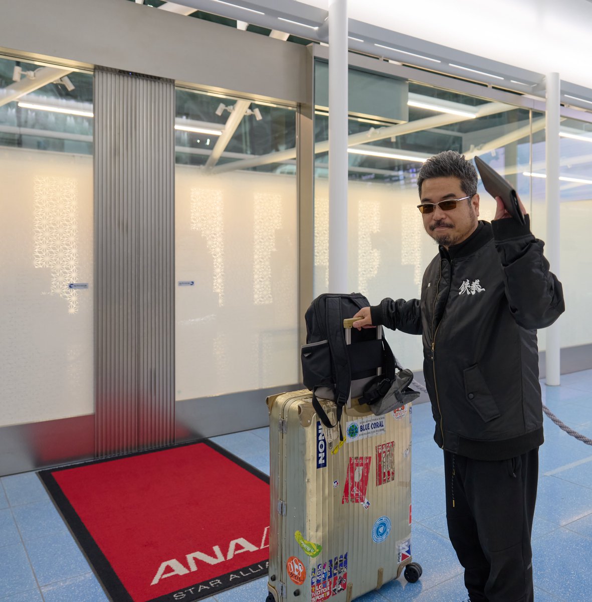 Harada is leaving the country through the executive gate in this