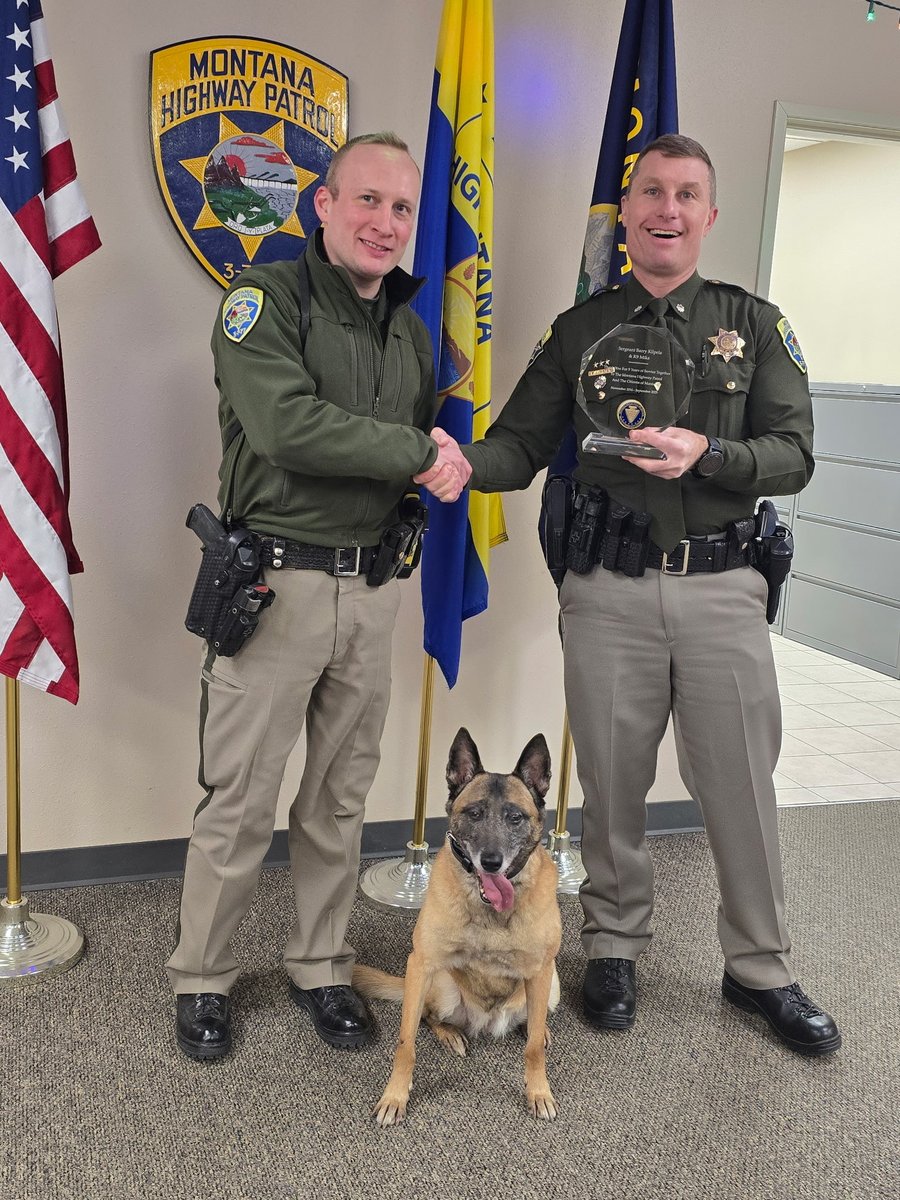 Retired K9 Mika came back to the office today to receive her 9-year service crystal from Lieutenant Colonel Kyle Hayter (right). Sergeant Kilpela took the crystal home for Mika, and she was spoiled with lots of treats during her visit.
