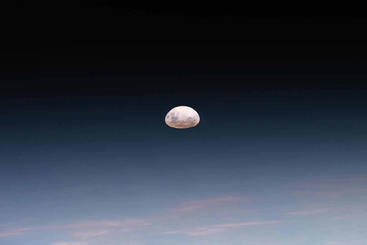 Our Moon distorted through the atmosphere as it sets beyond Earth's orbital horizon. Soon to know a human presence once again with Artemis II