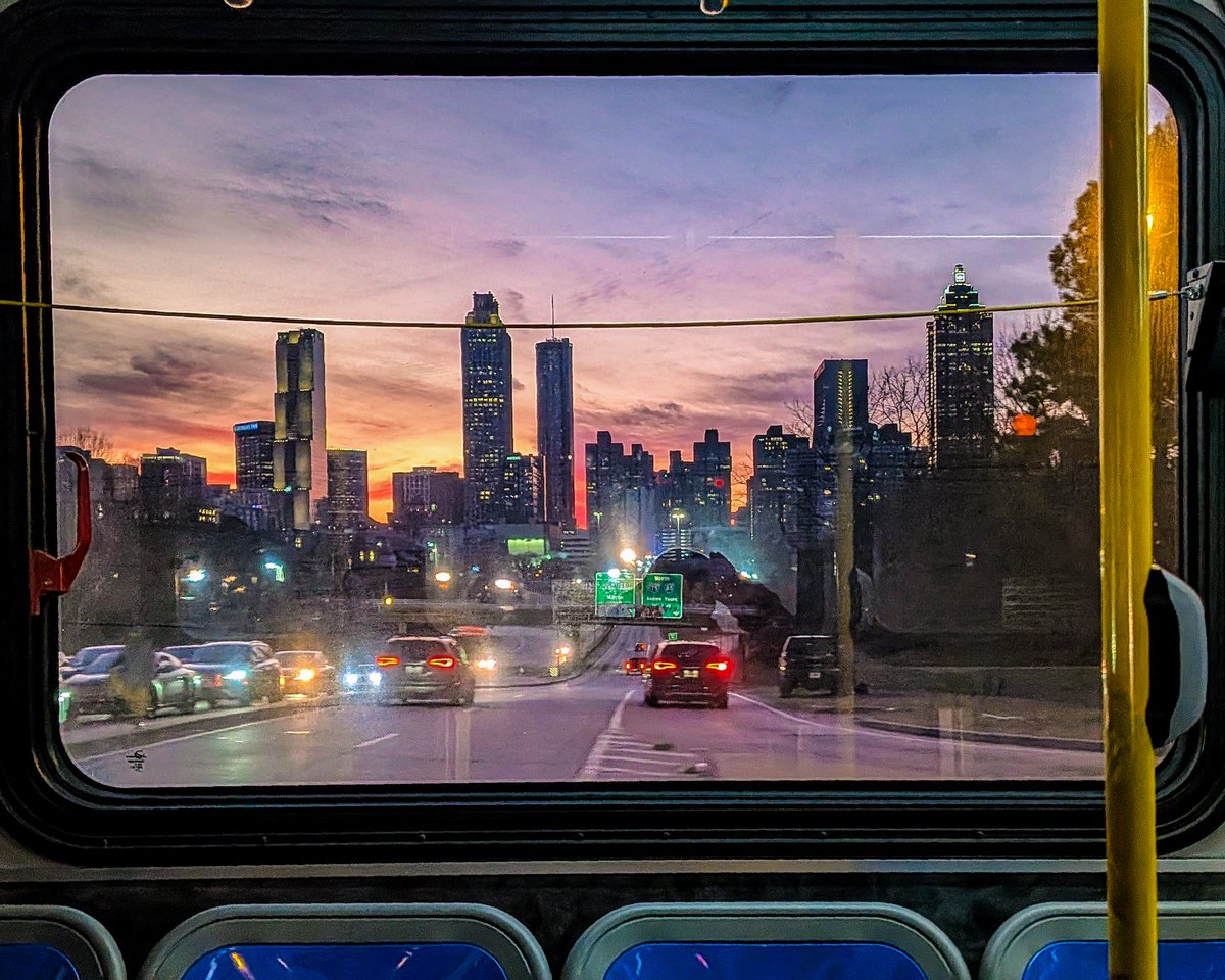 atlurbanist's tweet photo. Colorful sunset over Downtown Atlanta, as seen tonight from the window of an in-motion MARTA bus. https://t.co/Fkj18C45YU