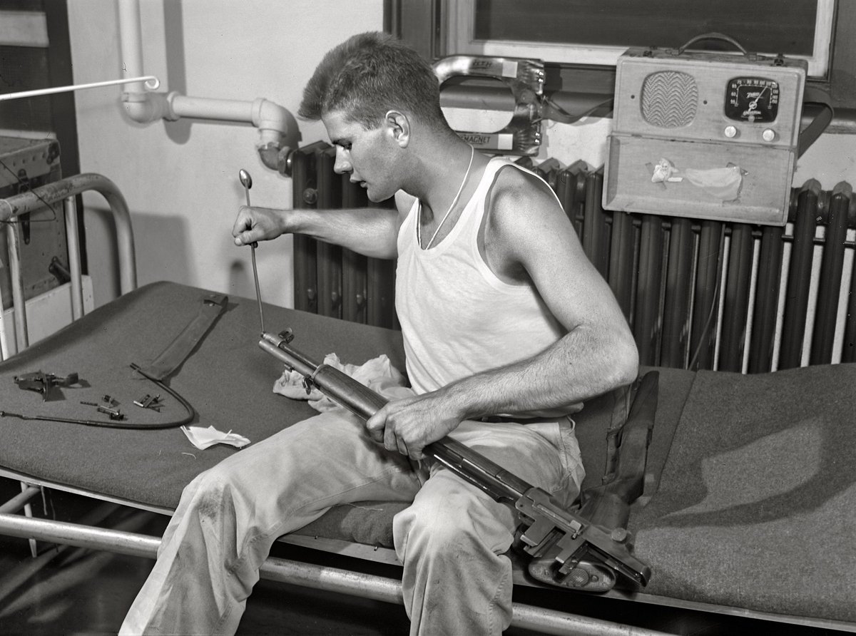 Fort Belvoir, Virginia. Sergeant George Camplair cleans his rifle regularly. 1942