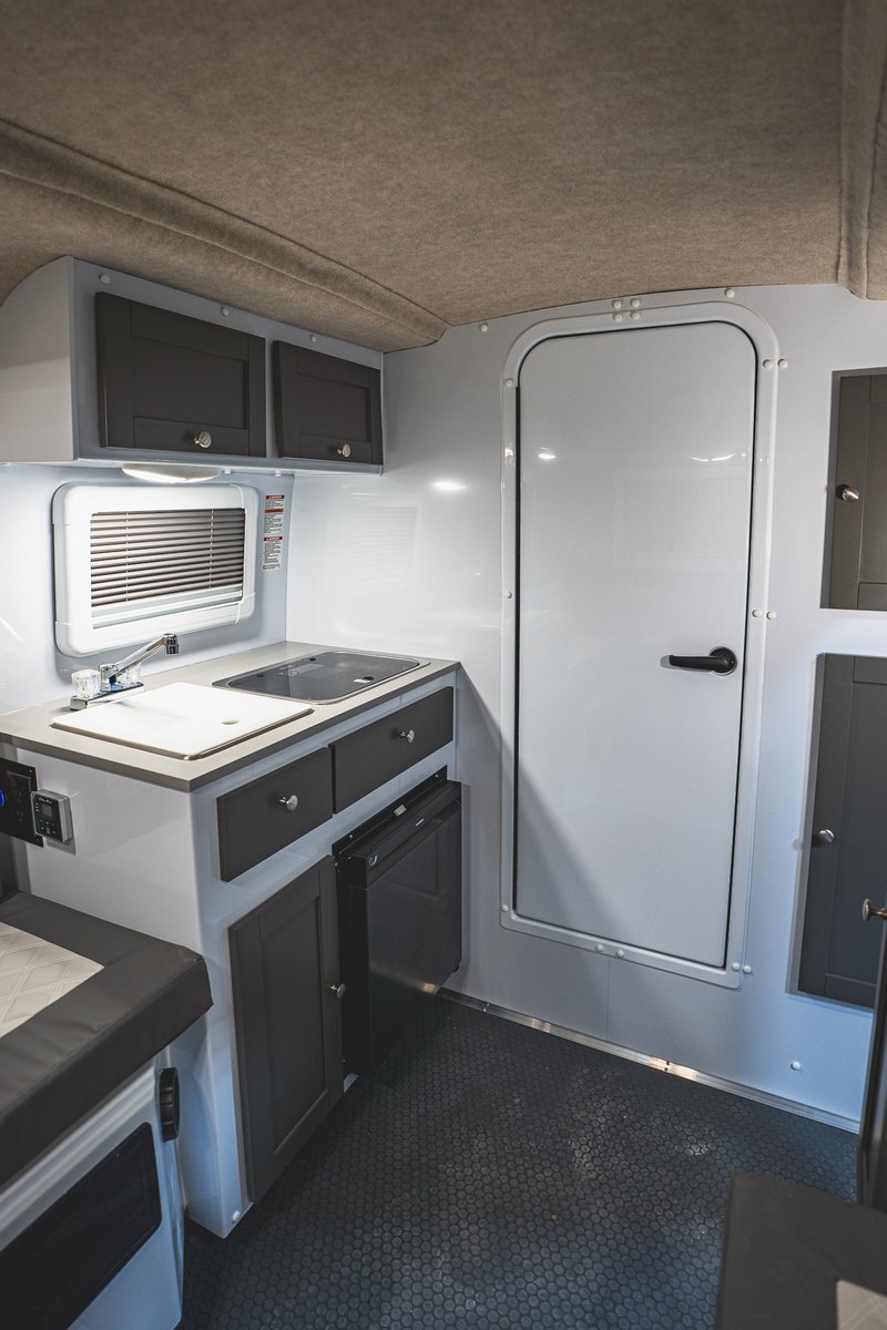 Scamp_Trailers's tweet photo. Here’s your first look at the all-new Scamp X ALT interior!
Featuring a front bath, rear dinette that converts into a bed, and new dark gray cabinets paired with a light gray table. Clean, modern, and designed to make every trip more comfortable. https://t.co/LdaIm5LvkW