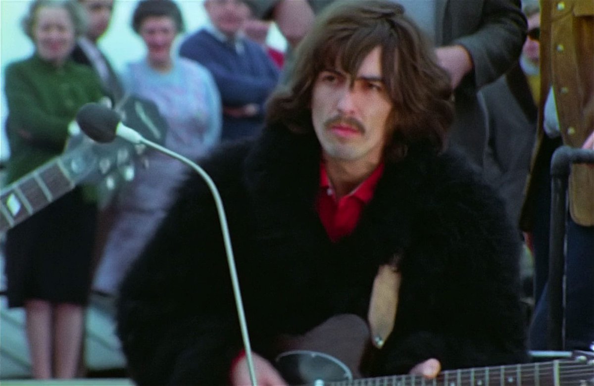 george harrison during the beatles’ iconic apple studios rooftop performance on the 21st day of the get back/let it be sessions — january 30, 1969