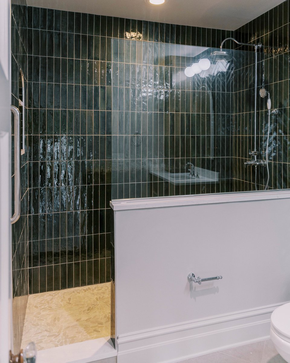 NelsonConstReno's tweet photo. With this historic home restoration project, our team of project managers in collaboration with our designers are reimagining spaces together—building a modern bathroom upon the existing structural elements of this beautiful historic home. The client chose dramatic deep green vertical tile and a frameless glass shower to create an elegant, timeless bathroom that honors the past while embracing contemporary comfort.
#NelsonConstructionRenos #HistoricHomeRenovation #BathroomRemodel #TampaBayContractor #LuxuryBathroom