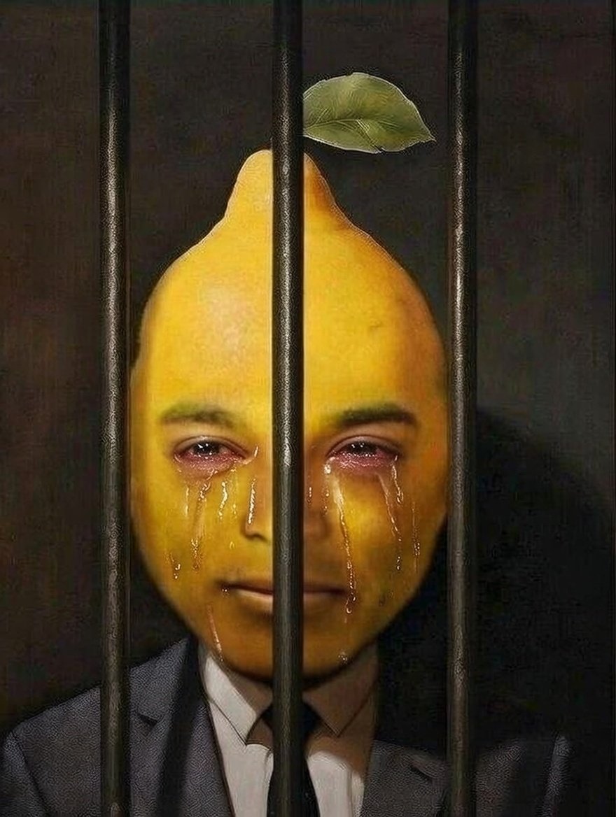 Meme image of a lemon with a human face (resembling Don Lemon) crying behind jail bars, wearing a suit