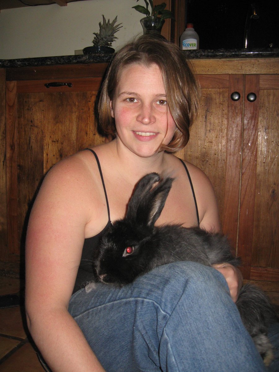AshleyAdamant's tweet photo. This one just came up in my “memories” feed. I can’t believe that was 12 years ago, not too long after we moved to our off grid cabin, and I’m sitting on the floor of our kitchen by the stove grooming one of our angoras hoping to make a hat from the fiber she sheds. Kind of a lifetime ago, but also kinda still the same life. Just without her. I miss that bun.
