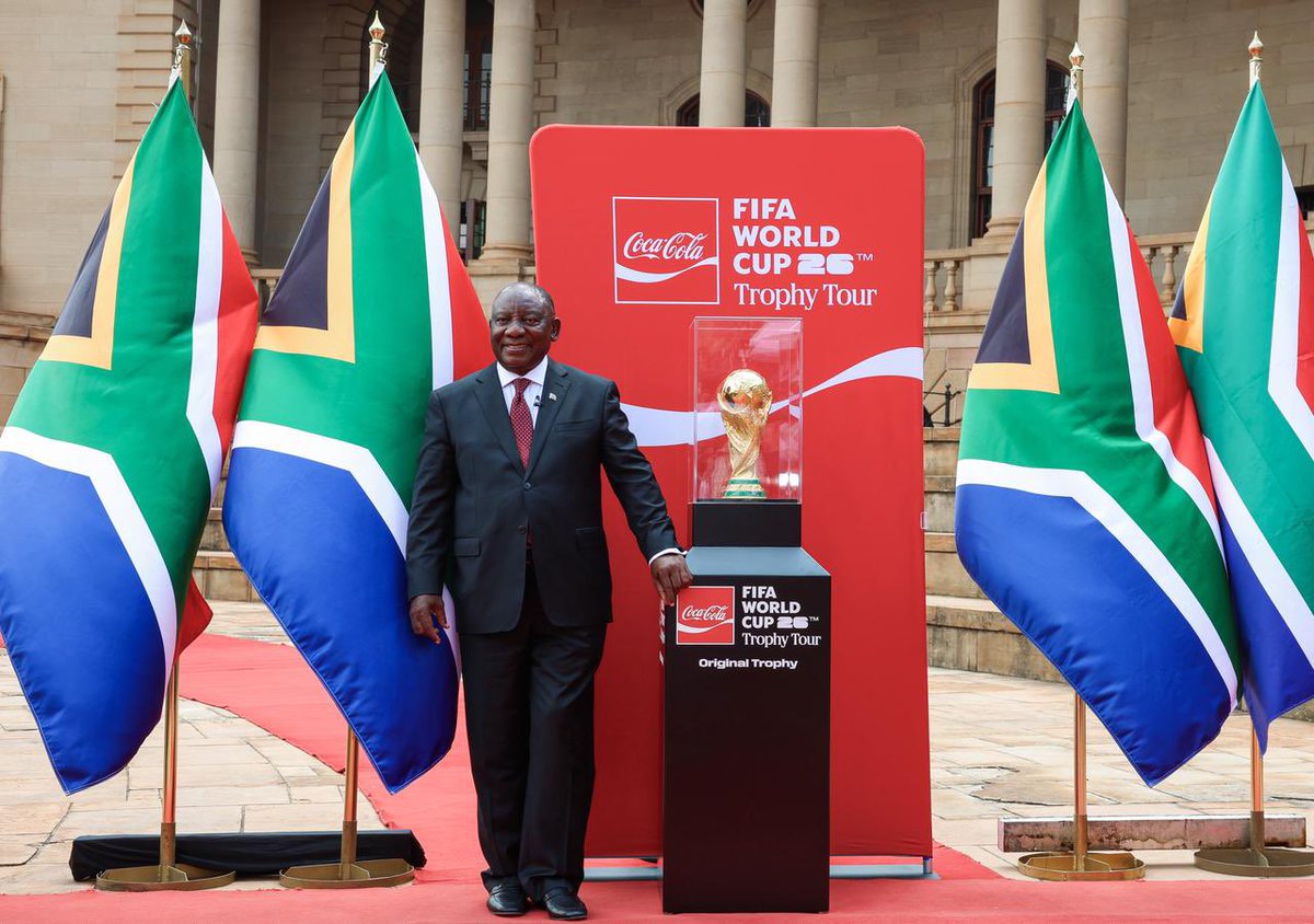 PresidencyZA's tweet photo. 🇿🇦President @CyrilRamaphosa with the FIFA World Cup™️ Original Trophy during the FIFA World Cup™️ 2026 SA Trophy Tour held at the Nelson Mandela Amphitheatre at the Union Buildings.

The Trophy’s arrival represents hope, pride, memory, and momentum. It marks the symbolic beginning of South Africa’s return to the FIFA World Cup™️, a moment in which the future of South African football is placed, both physically and emotionally, into the hands of its people.

#FIFAWorldCup 🏆🇿🇦