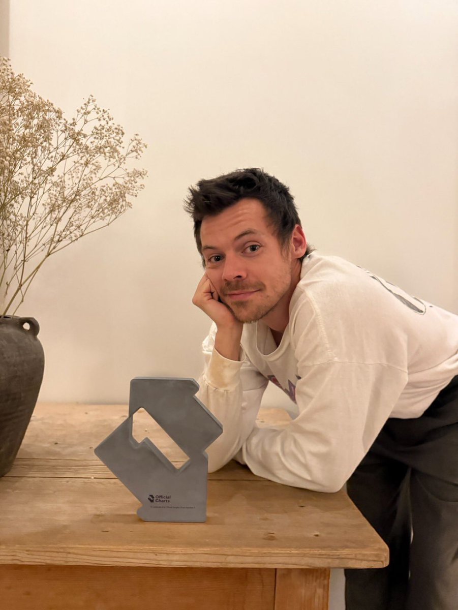 Harry with his award of number 1 on the UK’s Official Singles Chart!
