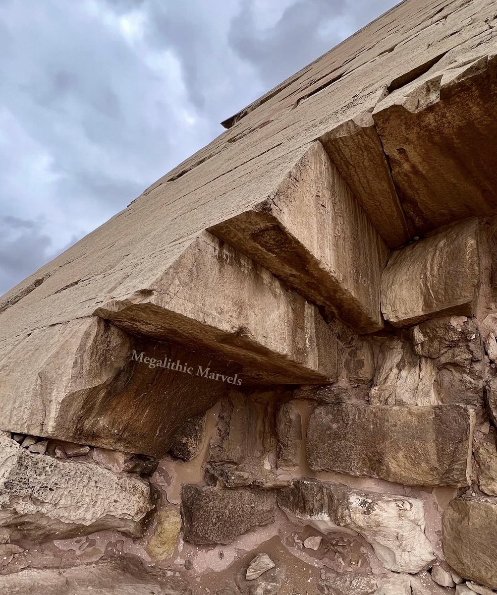 derek__olson's tweet photo. Located at Dahshur about 25 miles south of Cairo is what many call the “Bent Pyramid,” which is said by mainstream Egyptology to have been built as a tomb under the Old Kingdom Pharaoh Sneferu (approx 2600 BC). 

Prominent theories regarding its strange shape include that it was either damaged during construction or that the builders made a miss-calculation during construction & therefore changed their plans. 

OR was this pyramid made precisely this way for a uniquely different purpose? The walls of the lower part of the pyramid rise at an angle of 54 degrees, then, at about 161 feet above the base, there is an abrupt flattening of the slope to 43 degrees.

You can see that some type of liquid was leaking out of it, & this was causing erosion. Similar to a modern day microwave, something within was forcing the moisture in its molecular structure to emanate out…

Why are crystals found all over the ground at this site only, & not next door at the Red pyramid? Was this pyramid covered with them until they fell off after some explosion inside?  

The inside of this trapezoidal super-structure is made with megalithic multi-ton blocks. Did Sneferu find this pyramid & re-purpose it as a tomb?

Join me to explore this very pyramid this December on our Egypt tour! Learn more here https://t.co/E0rSYXLa9l

Follow me for more ancient history content