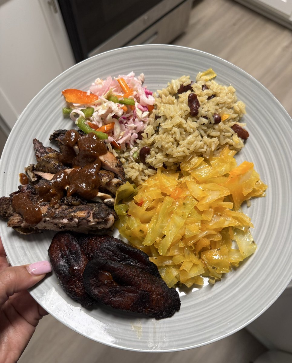 Yesterday’s plate. jerk chicken, rice and peas, cabbage, and pikliz. 😋
