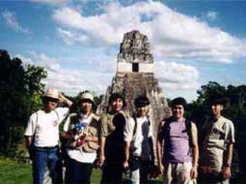 To prepare for the development of Sonic Adventure, Sonic Team traveled to South America to take inspiration. 

This resulted in several pictures of Sonic (and sometimes Knuckles) hanging around Tical, Machu Picchu, and other locations.