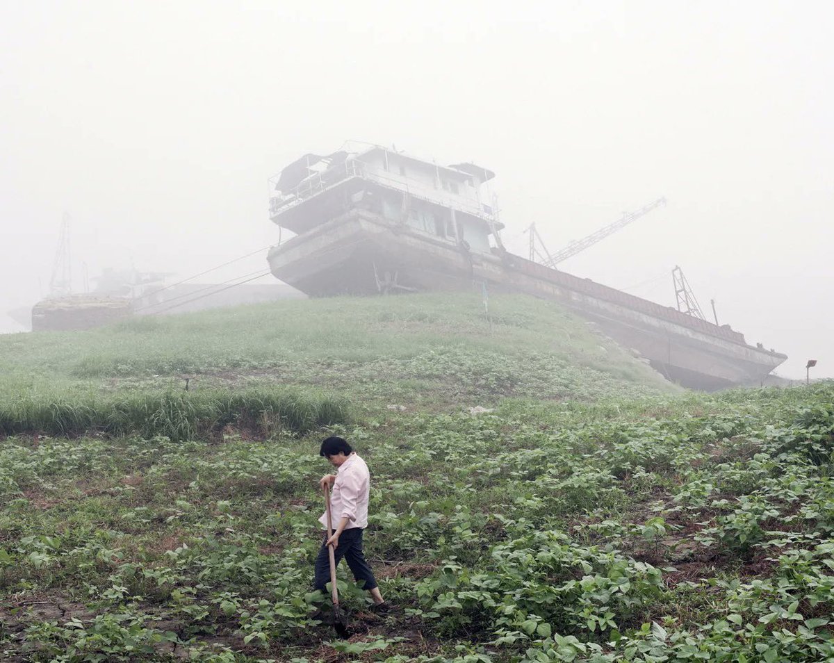 Abandoned ships along the Yangtze River长江, Chongqing, 2012 , by John Francis Peters.