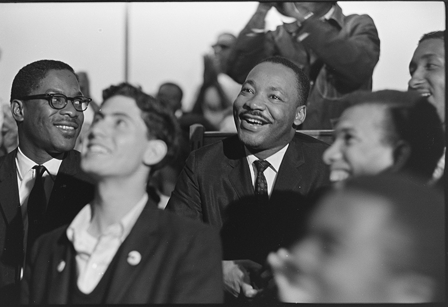 librarycongress's tweet photo. On this Martin Luther King, Jr. Day, enjoy images from The Glen Pearcy Collection at the Library of Congress. A rare, unguarded public moment of Dr. King smiling at a March 1965 Student Nonviolent Coordinating Committee meeting—a snapshot of joy amid a historic civil rights struggle—is a highlight.