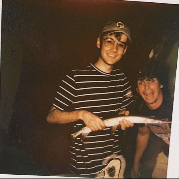 dextbur's tweet image. this photo always makes me chuckle like who does he think he is with his buc-ee’s hat and fish