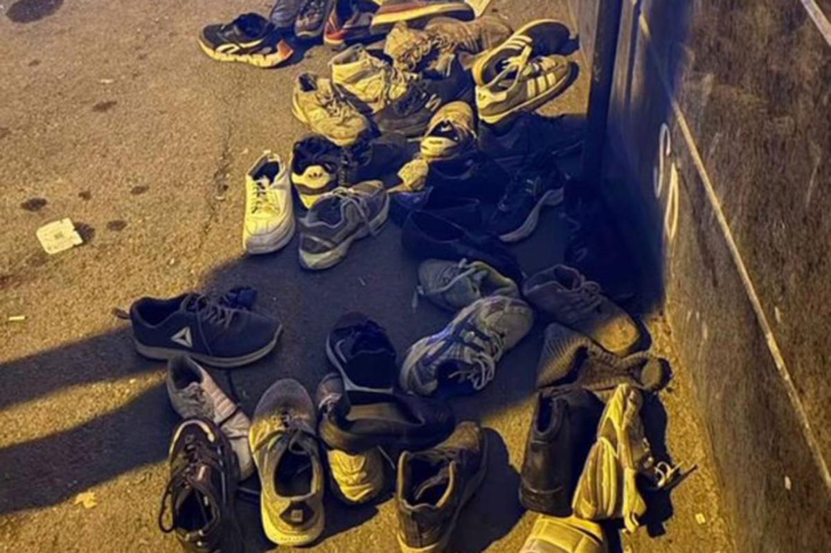 nypost's tweet image. Haunting image shows pile of abandoned shoes after Iran’s bloodthirsty regime burned protesters to death: ‘Iranian Holocaust’ trib.al/w3ngQD9