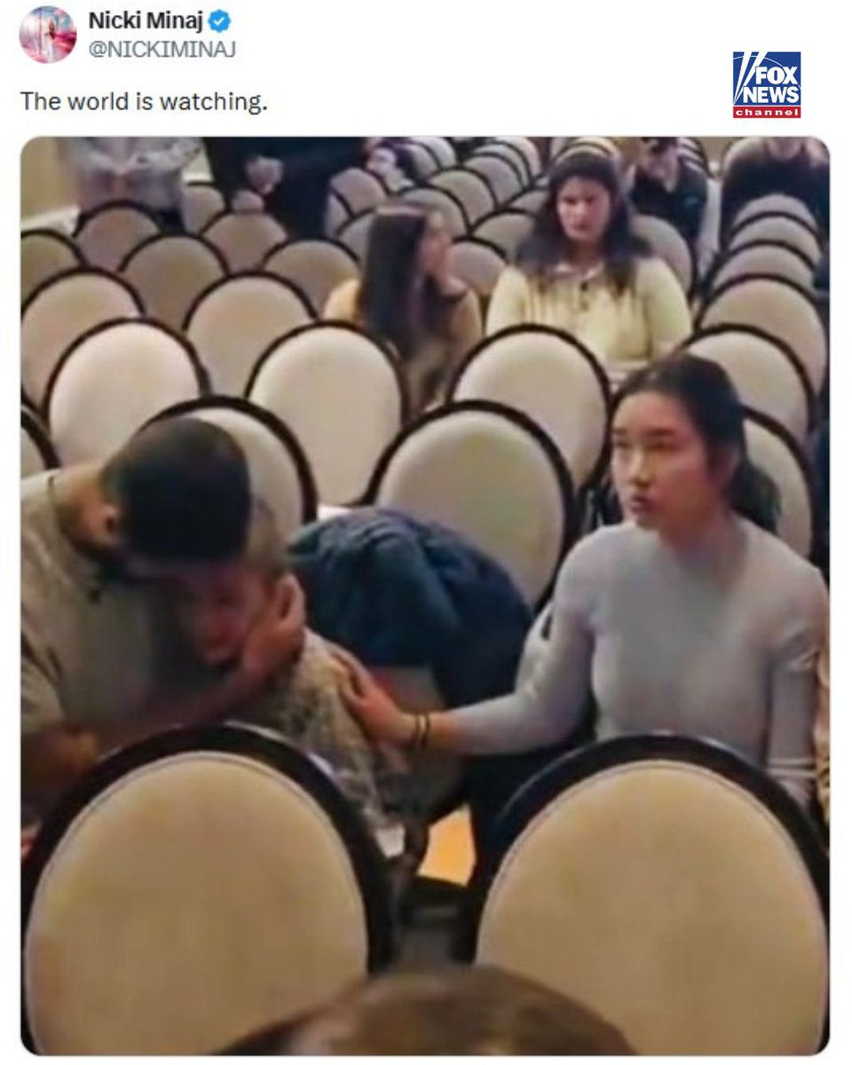 Rapper Nicki Minaj shares a photo online of what appears to be a father holding his crying son as anti-ICE agitators stormed a Minnesota church during Sunday service.

She captioned the image, which has been getting a lot of attention online, "The world is watching."

The star