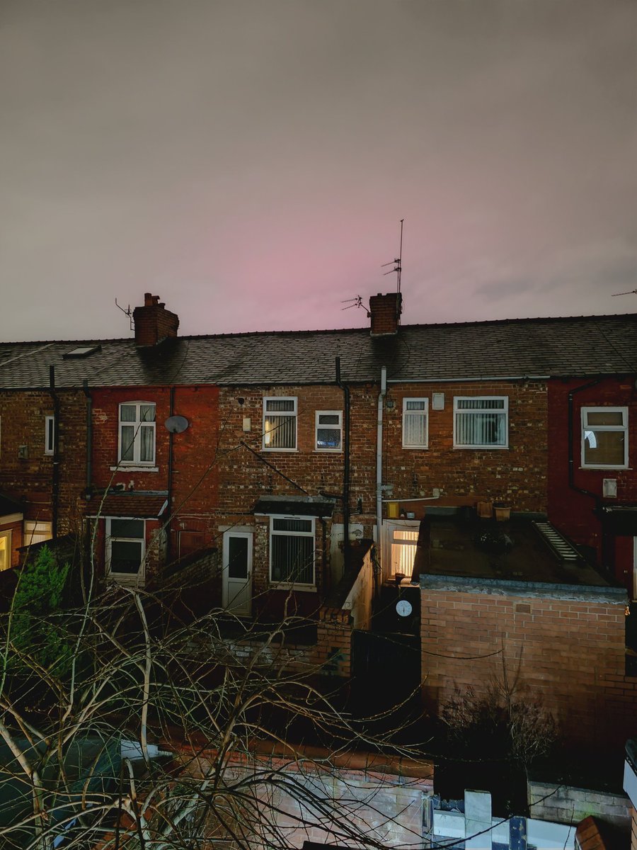 The aurora is there behind the clouds, facing North from Manchester, UK. I've lived here for 25 years, we don't get pink clouds! #Aurora #NorthernLights