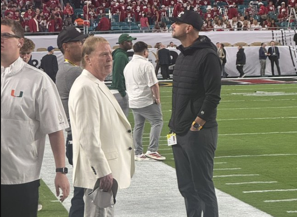 tombrewsports's tweet photo. Tom Brady and Mark Davis from the Las Vegas Raiders are down on the sidelines. I'll be STUNNED if they don't draft Indiana QB Fernando Mendoza with their first overall pick. #iufb @Raiders #NFLDraft https://t.co/9SU93y4Nec