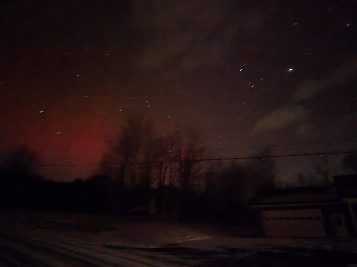 Northern lights in North Central PA.  Slight pink naked eye.  Vibrant with celll phone cam