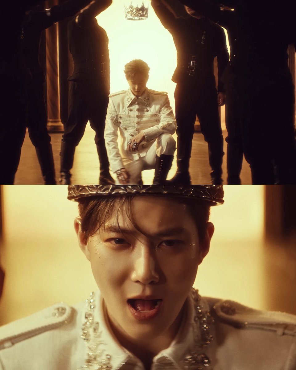 This doesn’t feel like kneeling to be crowned for power. It feels like Suho bowing in respect before the crown is placed. He’s already king and he still kneels. If EXO-L is the crown, then this is him honoring the ones who waited, stayed &amp; believed…and making a vow to protect it
