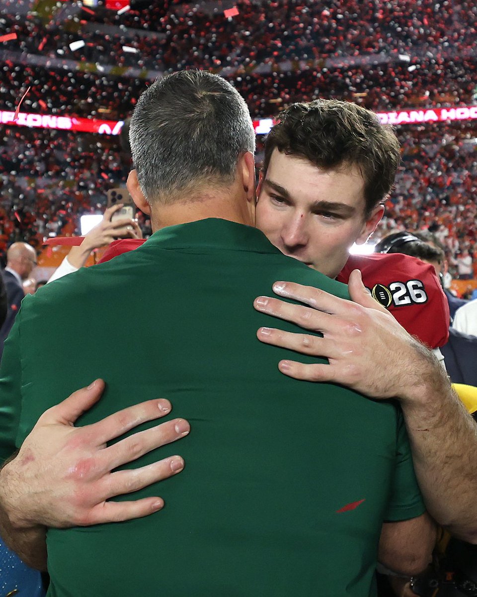 YahooSports's tweet photo. Fernando Mendoza and Mario Cristobal hugged after Indiana's National Title win ❤️ 

The Hoosiers QB and Miami HC both grew up in Miami and went to the same high school. https://t.co/bn7NAM7hGF