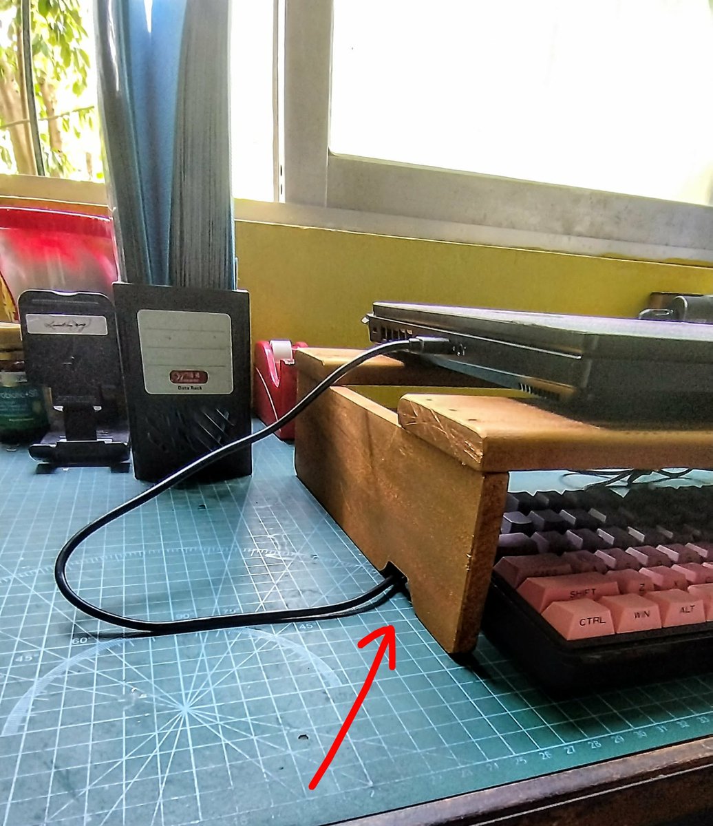 jactinglim's tweet photo. Project done! 
He made a laptop stand to raise it over the keyboard to improve ergonomics. Also made sure it has ventilation at the bottom and added a small hole for the cable 🥰 https://t.co/zUMQc0lVwN