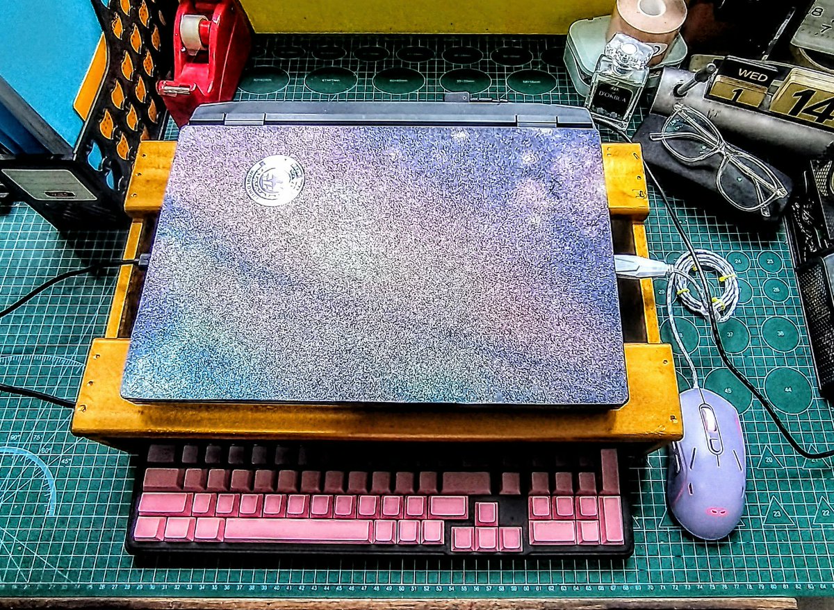 jactinglim's tweet photo. Project done! 
He made a laptop stand to raise it over the keyboard to improve ergonomics. Also made sure it has ventilation at the bottom and added a small hole for the cable 🥰 https://t.co/zUMQc0lVwN